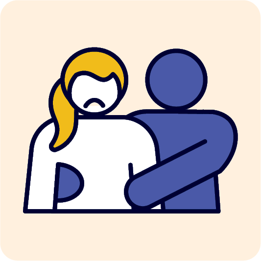 A person touching someone who looks upset.